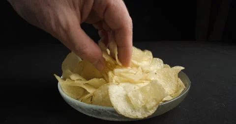 Chips picking close-up in studio 4K Stock-Footage 277002623