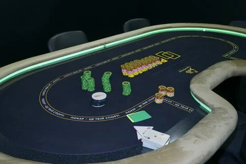 Chips placed on a table before the game, equipment made by Game Bridge. Stock Photos