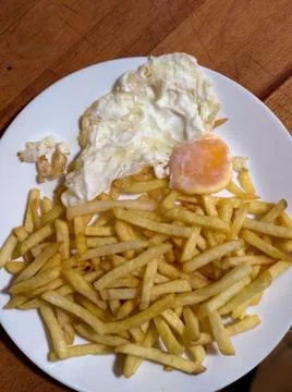 Chips plate with a fried egg Stock Photos