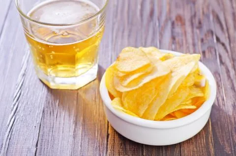 Chips from potato with beer Stock Photos