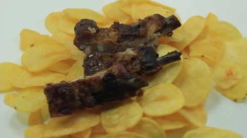 Chips with roasted pork ribs Stock Footage 104752712