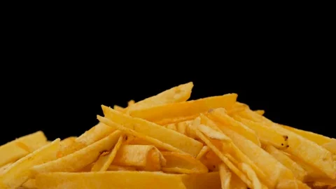 Chips rotate on a black background. Beer snack. Close up Stock Footage 135675249