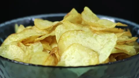 The chips on the table are spinning in a transparent blue plate Stock Footage 249764645