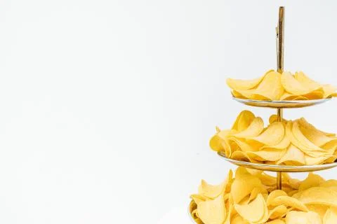 Chips texture crisp potato background of golden unhealthy food . Stock Photos