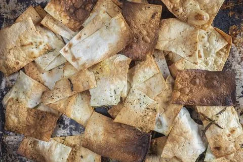 Chips from thin dough background copy space Stock Photos