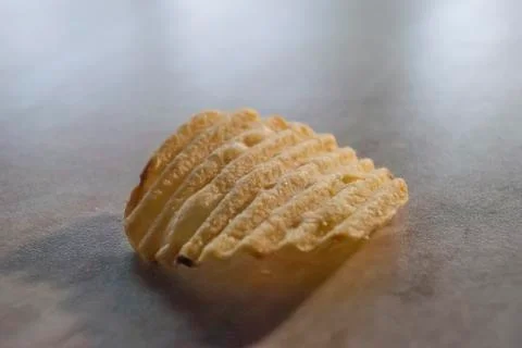 Chips on white table closeup Stock Photos