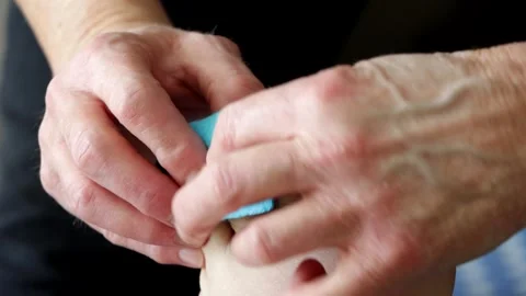Chiropodist toe plaster Stock Footage 247449561