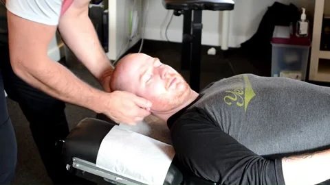 Chiropractic physiotherapist manipulation neck Stock Footage 248034035