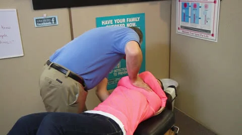 Chiropractor adjust patient Stock Footage 26829127