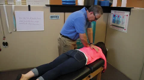 Chiropractor Adjust Patients Back - Wide Shot Video stock 26883643