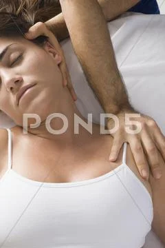 Chiropractor Adjusting Woman's Neck