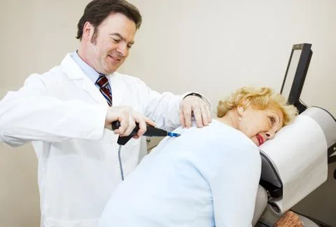Chiropractor Enjoys His Work Stock Photos