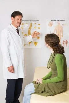 Chiropractor Explains Spinal Column Stock Photos
