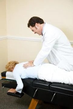 Chiropractor Manipulating Spine Stock Photos