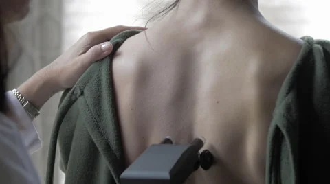 Chiropractor Scans Neck Stock Footage 40296640