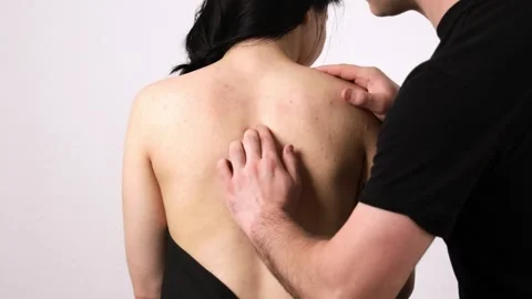 Chiropractor treating a patient's back Stock Footage 296734993