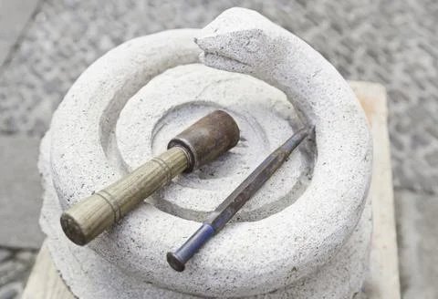 Chisel and hammer stone working, detail of stone carving, antique and traditi Stock Photos