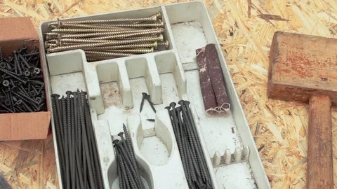 Chisel and self-tapping screws on plate Stock Footage 77936710