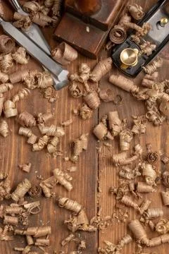 Chisel and small block plane with wood shavings Stock Photos