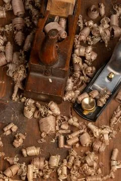 Chisel and small block plane with wood shavings Stock Photos