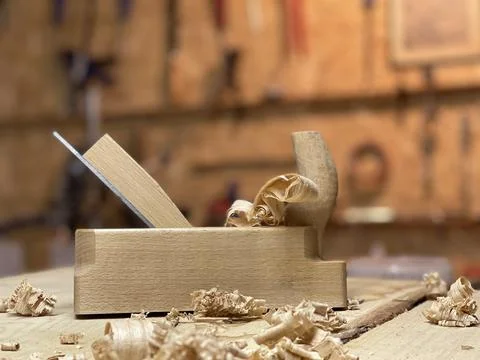 Chisel and small block plane with wood shavings. Carpenter cabinet maker hand Stock Photos