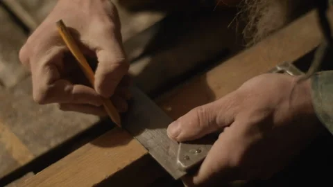 Chisel a chamfer on a wooden block with pencil marks Video stock 169156172