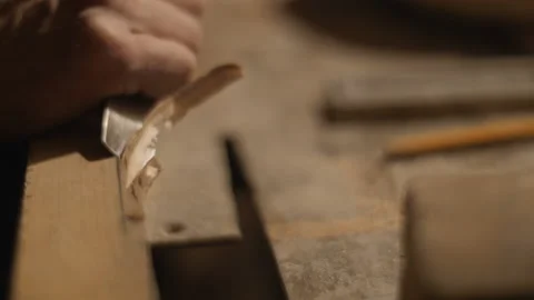 Chisel a chamfer on a wooden block with pencil marks Stock Footage 169156400