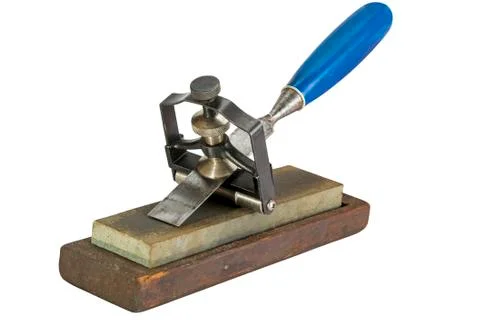 Chisel Clamped in Angle Guide Jigs on Grinding Whetstones Photos