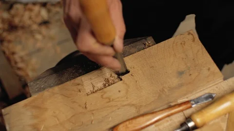Chisel in the hands of a professional carpenter.carpentry tools.4k Stock Footage 105637752