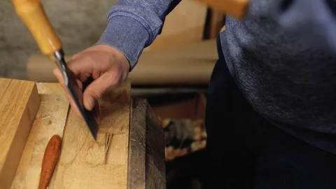 Chisel in the hands of a professional carpenter.carpentry tools.4k Stock Footage 105637805