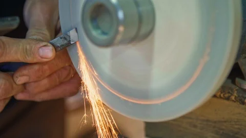 A chisel is producing sparks while is sharpened. Stock Footage 103605837