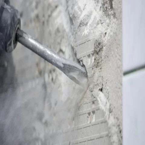 Chisel removing plastering on wall Stock Footage 69281730