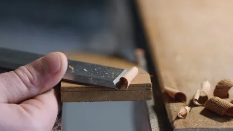 Chisel work. craftsman carpenter removes excess thickness from a wooden board Stock Footage 156669067