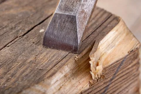 Chisel work in wood and raw wood shavings. Tools and accessories in a carpent Stock Photos