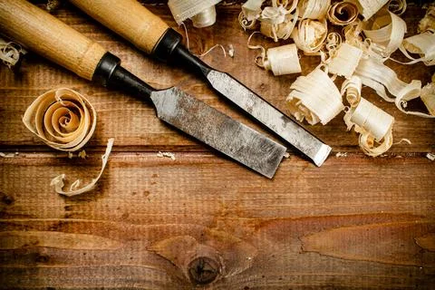 Chisels with wood chips on the table. Stock Photos