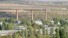 Chisinau industrial zone glass factory smokestacks Stock Footage