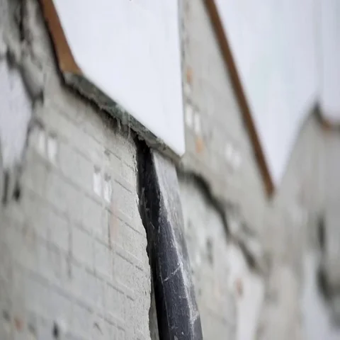 Chisle removing ceramic tile on wall Stock Footage 69280581