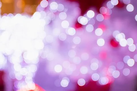Chistmast pattern background concept. Bokeh of pink and purple tone light. Stock Photos