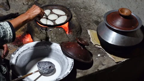 Chitai pitha is being made in a terracotta Stock Footage 341698891