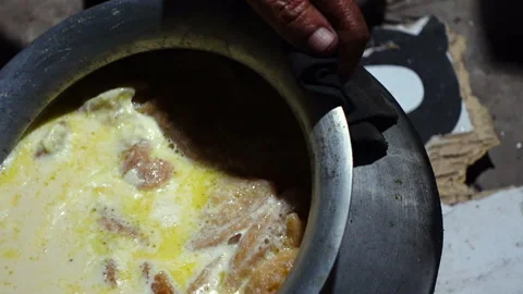 The Chitai Pitha was dipped in it, now milk Stock Footage 341699115