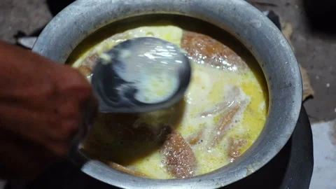 The Chitai Pitha was dipped in it, now milk Stock Footage 341699134