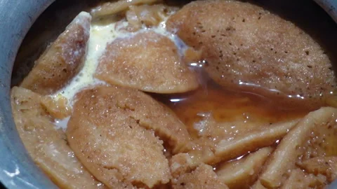 The Chitai Pitha was dipped in it, now milk Stock Footage 341699148