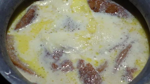 The Chitai Pitha was dipped in it, now milk Stock Footage 341699167