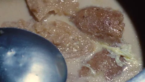 The Chitai Pitha was dipped in it, now milk Stock Footage 341699298