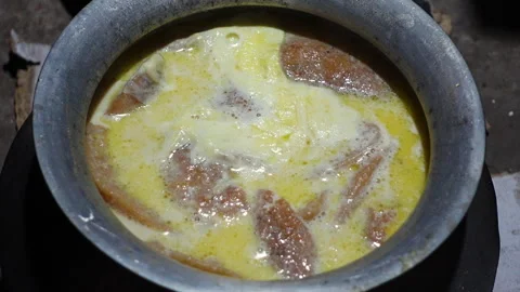 The Chitai Pitha was dipped in it, now milk Stock Footage 341699618