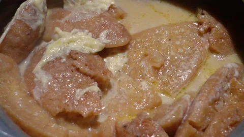 The Chitai Pitha was dipped in it, now milk Stock Footage 341699671