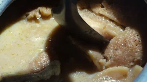 The Chitai Pitha was dipped in it, now milk Stock Footage 341699690