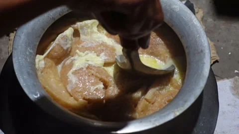 The Chitai Pitha was dipped in it, now milk Stock Footage 341699691