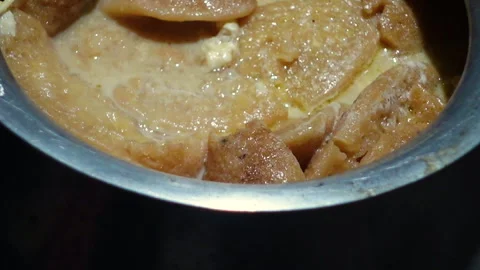The Chitai Pitha was dipped in it, now milk Stock Footage 341699784