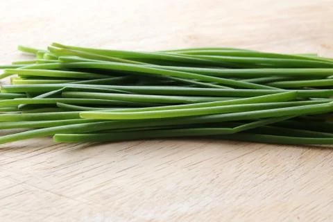 Chives on chopping board Stock Photos